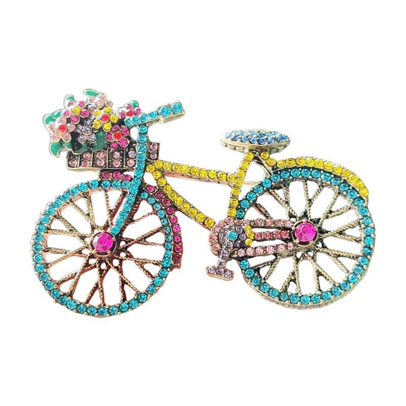 Stylish colourful rhinestone bicycle brooch close-up