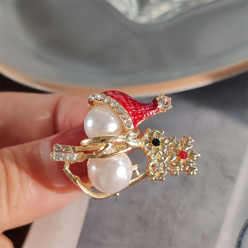 Side view of adorable snowman brooch with pearls
