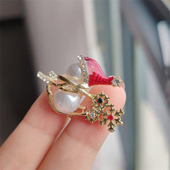 Snowman brooch displayed in a festive setting