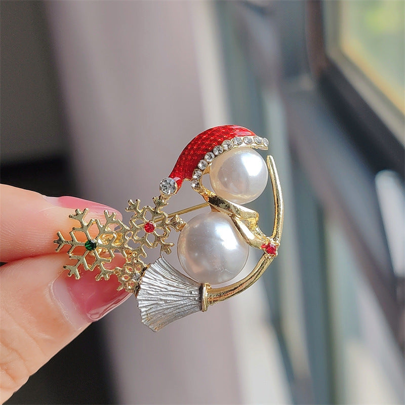 Close-up of Cute Christmas Pearl Snowman Brooch
