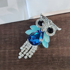 Vibrant owl brooch showcased in fashion setting