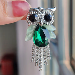 Close-up of sparkling owl pin design