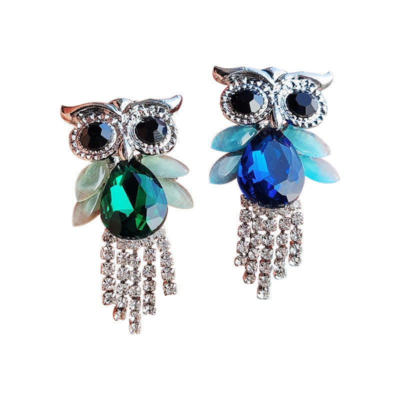 Vibrant owl brooch showcased in fashion setting