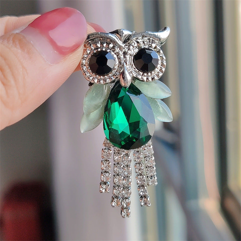 Fashion owl brooch in artistic arrangement