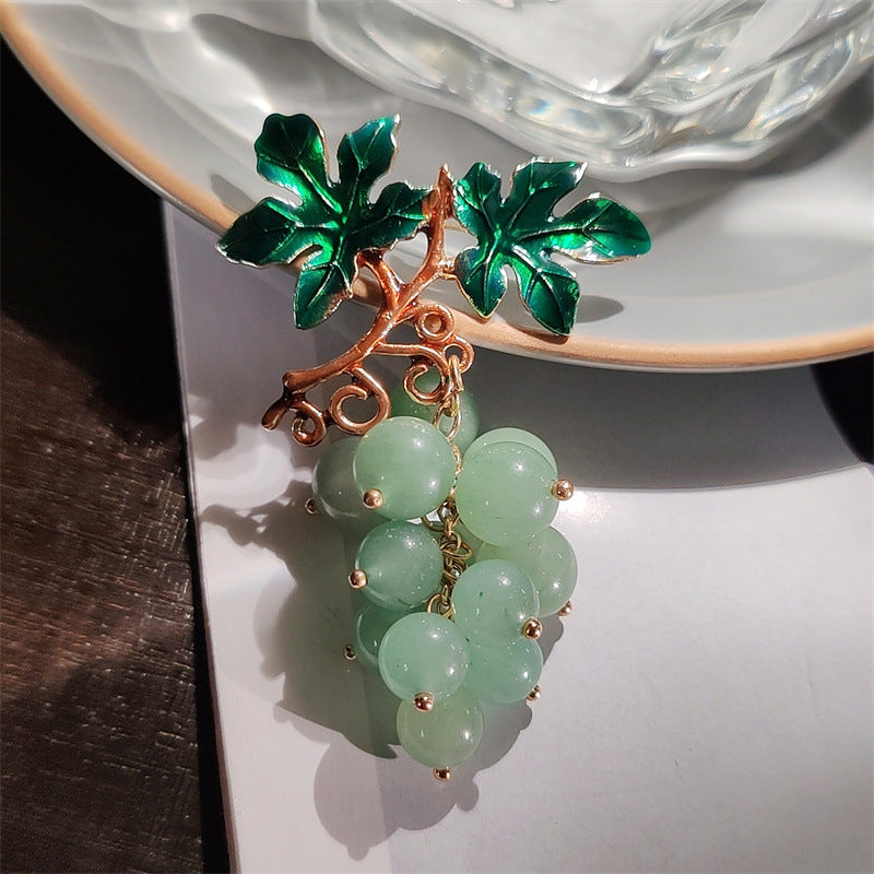 Detail of colourful brooch for fall fashion