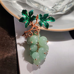 Detail of colourful brooch for fall fashion