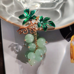 Detail of colourful brooch for fall fashion