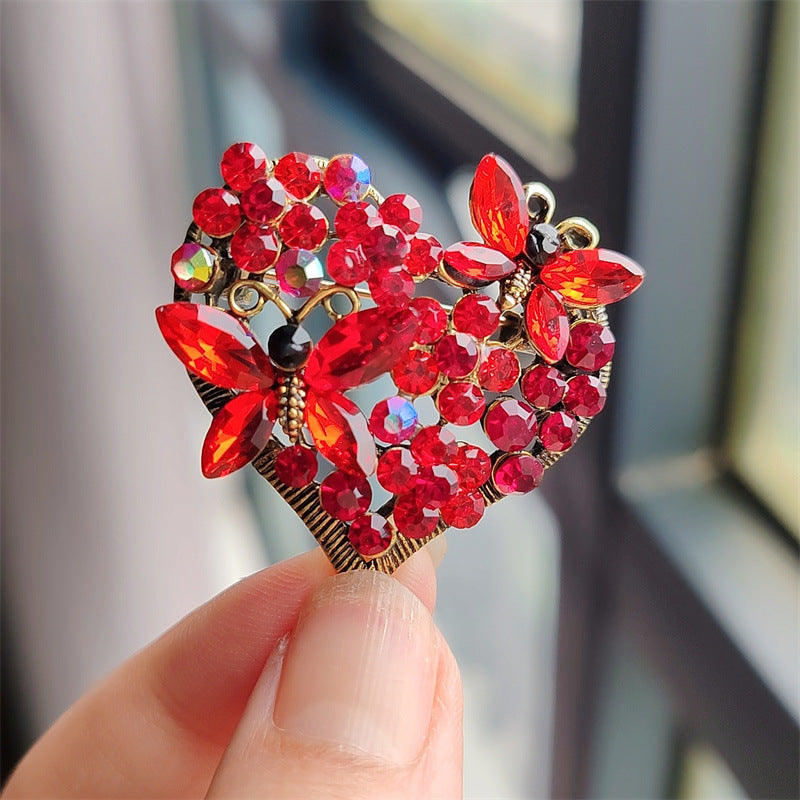Butterfly Heart Brooch pinned on a coat