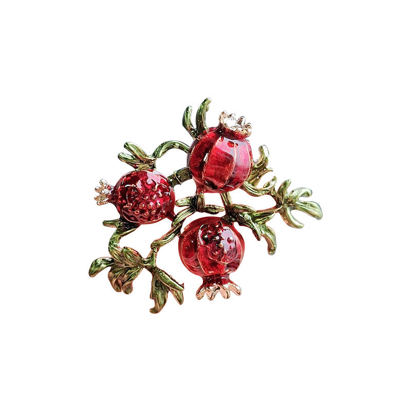 Colourful brooch attached to a fashionable bag