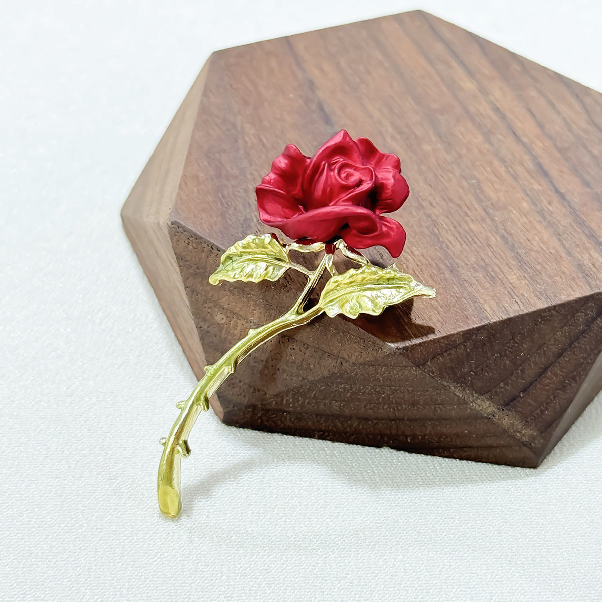 Close-up of Elegant Red Rose Brooch details