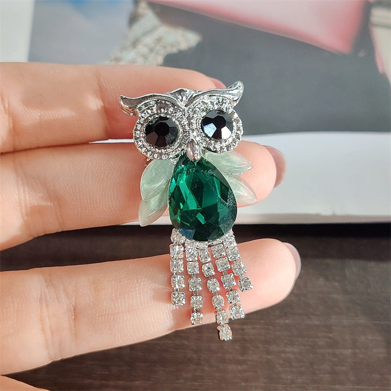 Blue owl brooch showcasing crystal detail