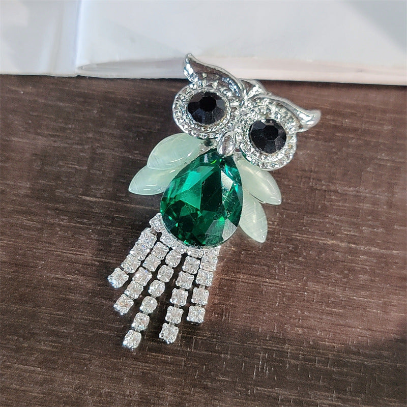 Charming owl design brooch on display