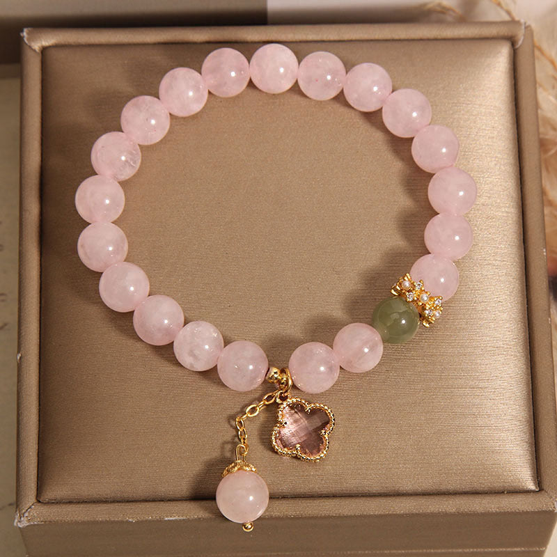 Bracelet with four leaf clover symbol