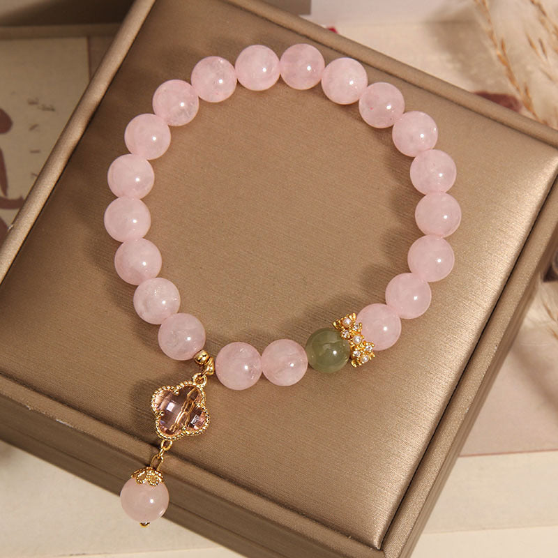 Elegant pink quartz bracelet with four leaf clover pendant