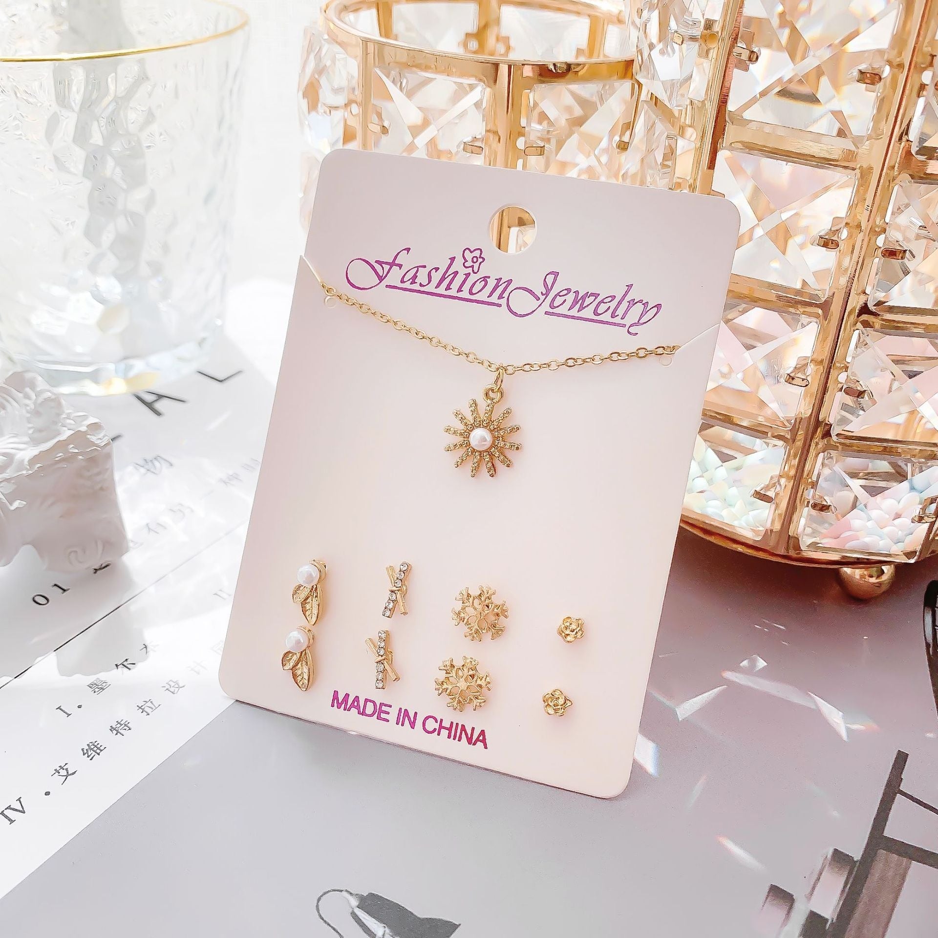 Set of minimalistic jewellery including necklace and earrings
