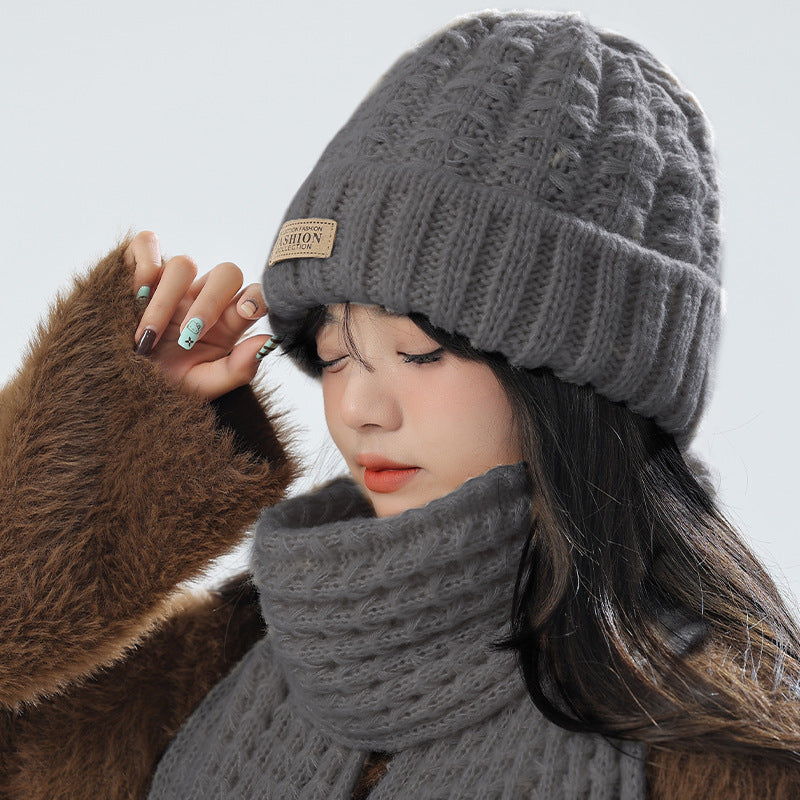 Gray knitted combo of hat and scarf for winter