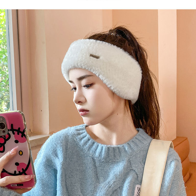 Stylish black beanie showcasing ear cover feature