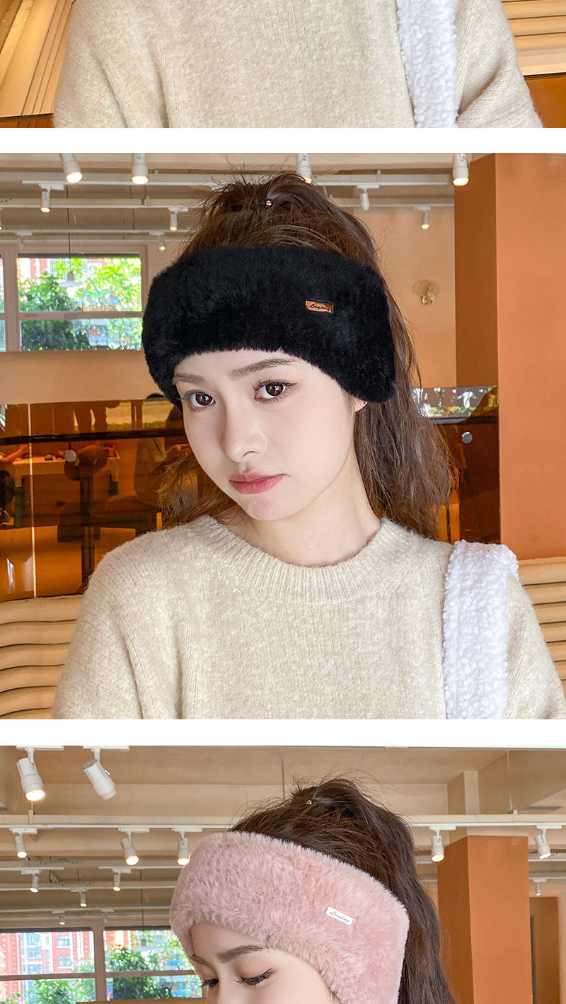 Pink winter beanie displayed in sporty wear