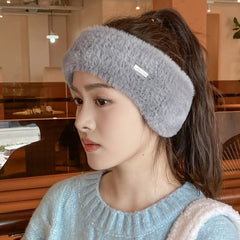 Black winter beanie shown in casual setting