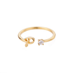 close-up of gold plated alphabet ring