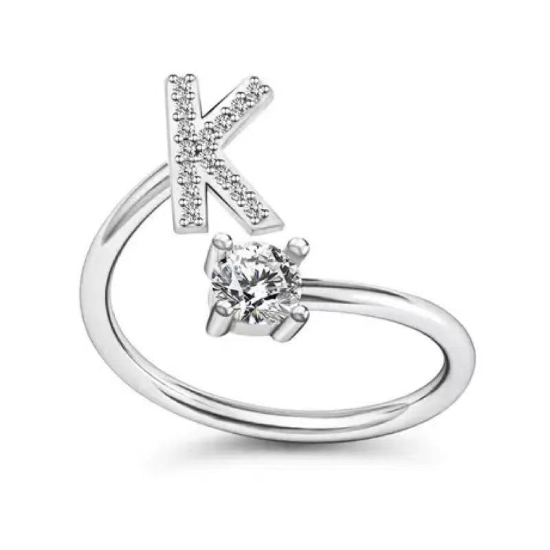 Fashionable women's alphabet ring on display