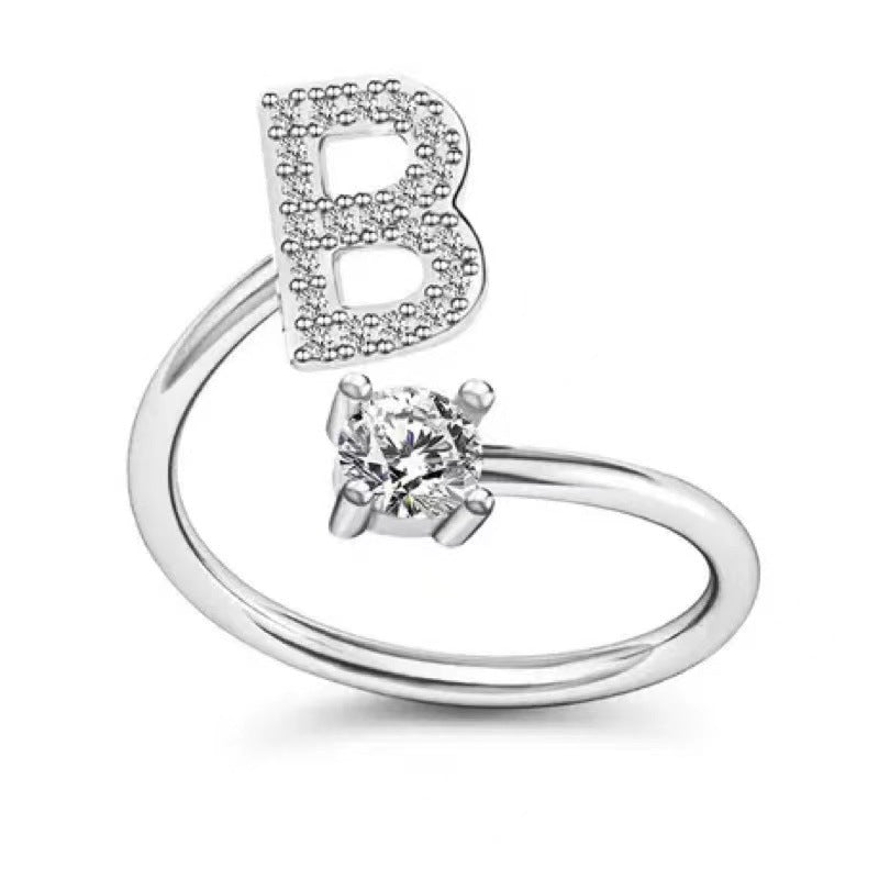 Fashionable women's alphabet ring on display