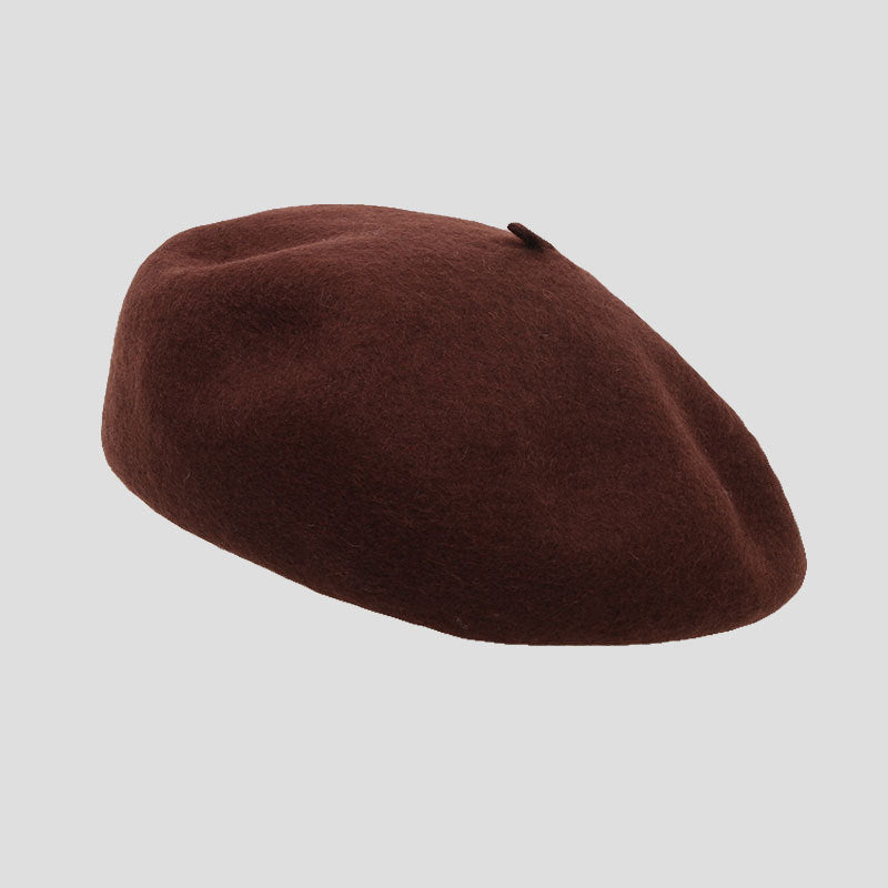 Chic brick red wool beret on display