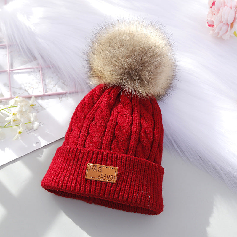 children wearing knitted beanie with pom-pom
