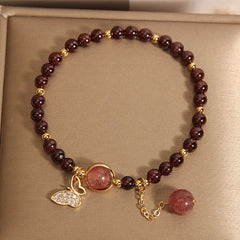 Elegant garnet butterfly bracelet on display