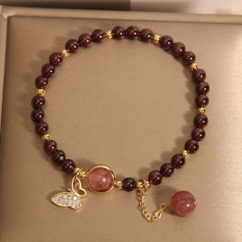 Elegant garnet butterfly bracelet on display