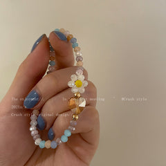 model wearing colourful floral necklace