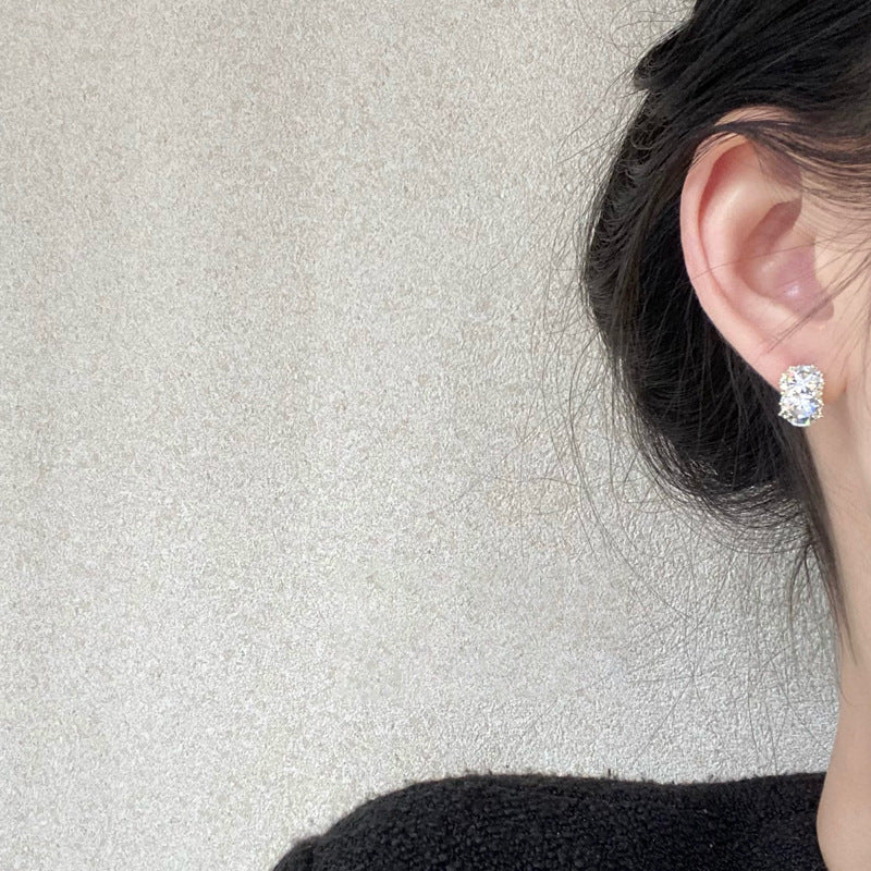 unique geometric earrings on a model