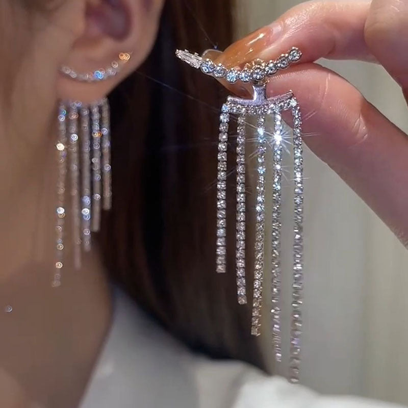 flat lay of fashionable tassel earrings