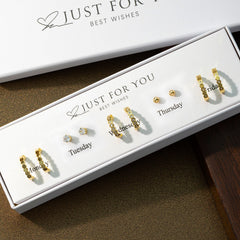 variety of silver earrings displayed image 3