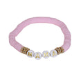 Various colours of polymer clay bracelets together