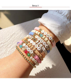 Colorful charm bracelet worn by a model outdoors