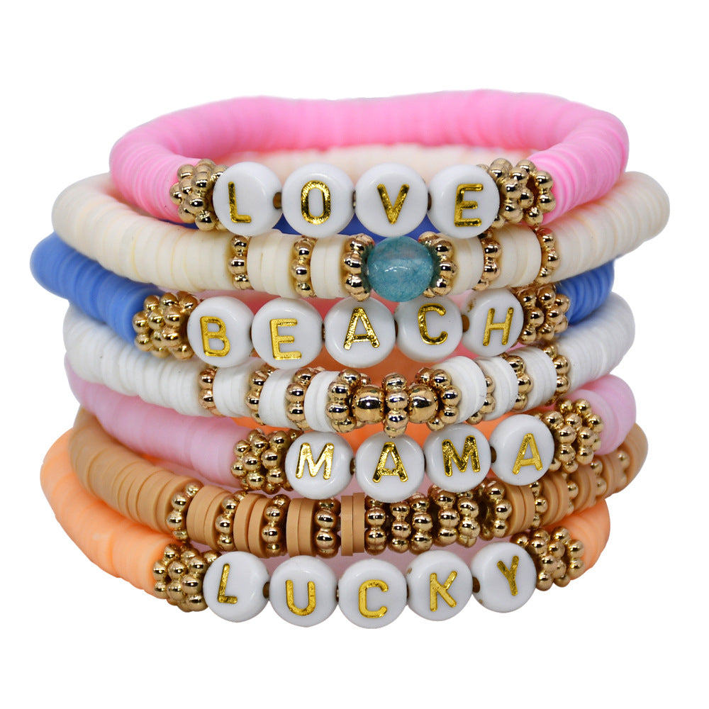 Elegant friendship bracelet stacked with other jewellery