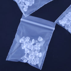 Silicone ear plugs shown in a clear packaging