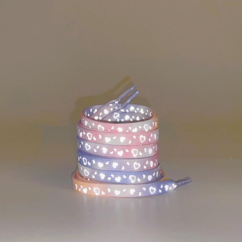 Close-up of black-blue reflective galaxy shoelaces
