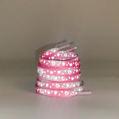 Mint green reflective shoelaces displayed on shoes