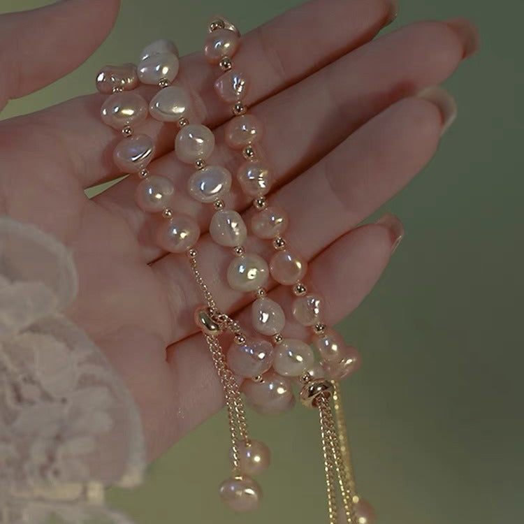 Stylish white faux pearl bracelet close-up