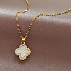 Stylish four-leaf clover necklace shown on a model