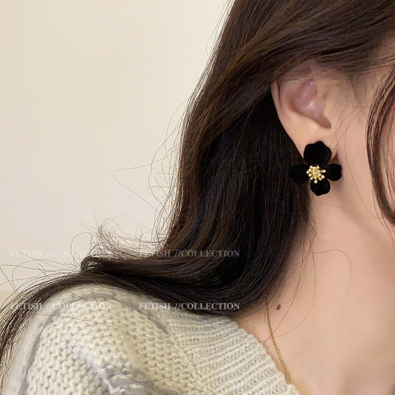Chic Velvet Earrings on a wooden background