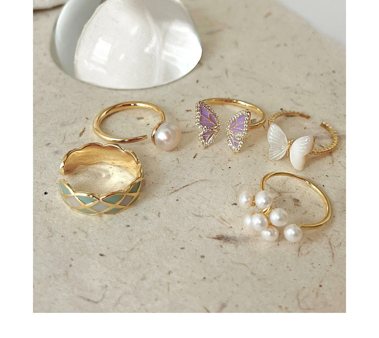 Butterfly ring with pearl accent on display