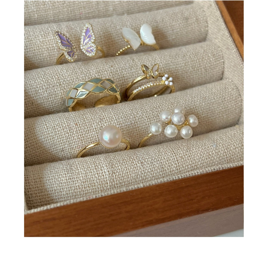 Adjustable open butterfly ring showcased
