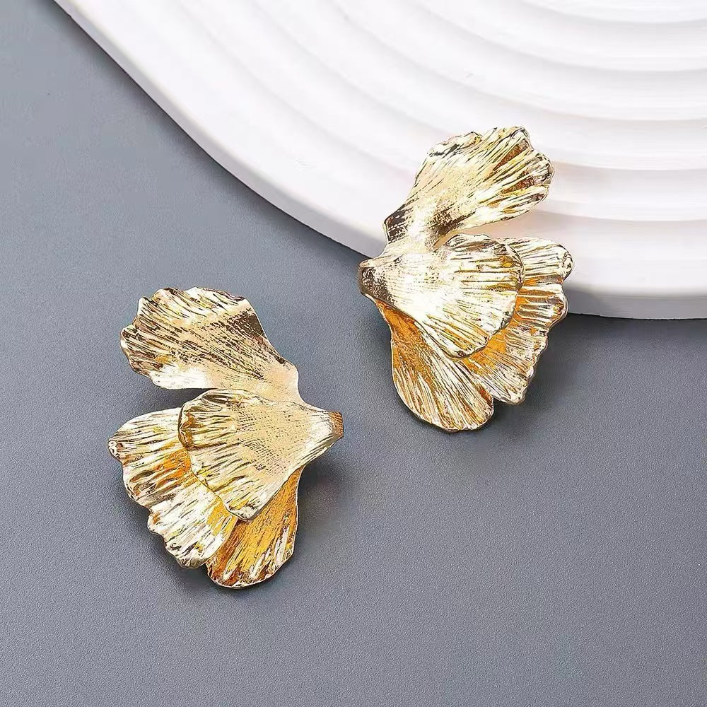 Beautiful leaf earrings against natural backdrop