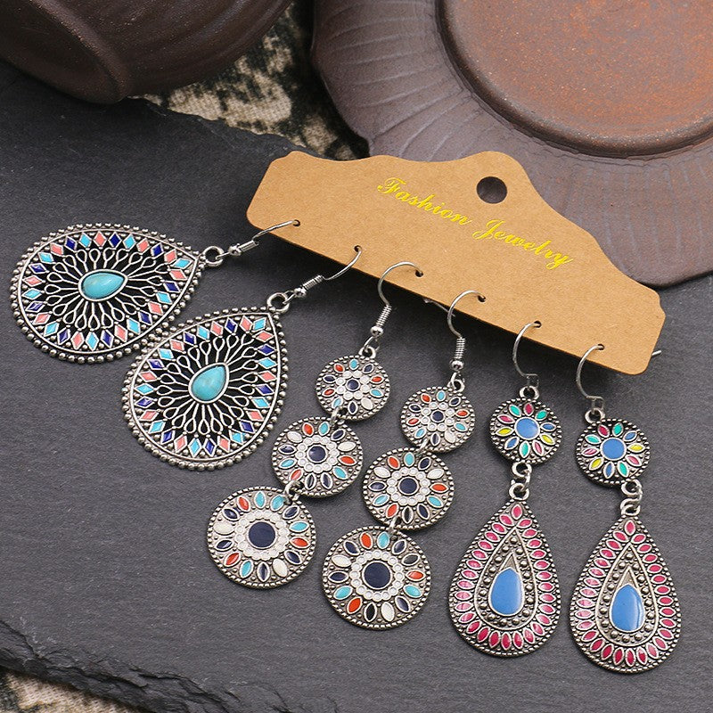 Geometric tassel earrings shown in three pairs