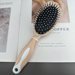 Universal hair comb on a wooden surface - image 4