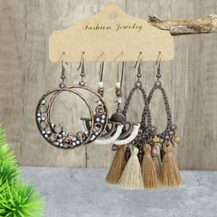 close-up of geometric design long tassel earrings