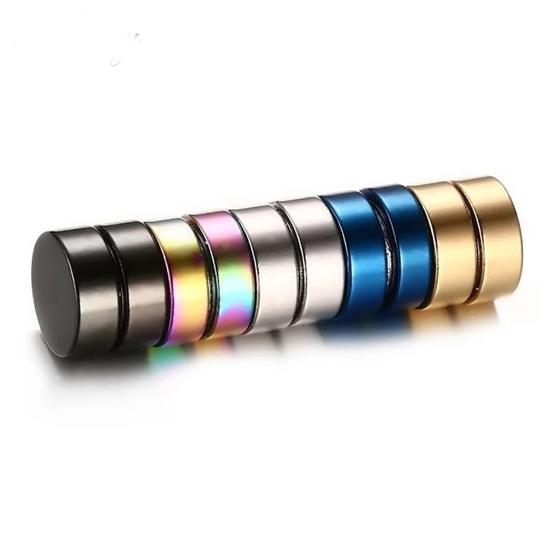 Geometric design titanium ear studs displayed on a model